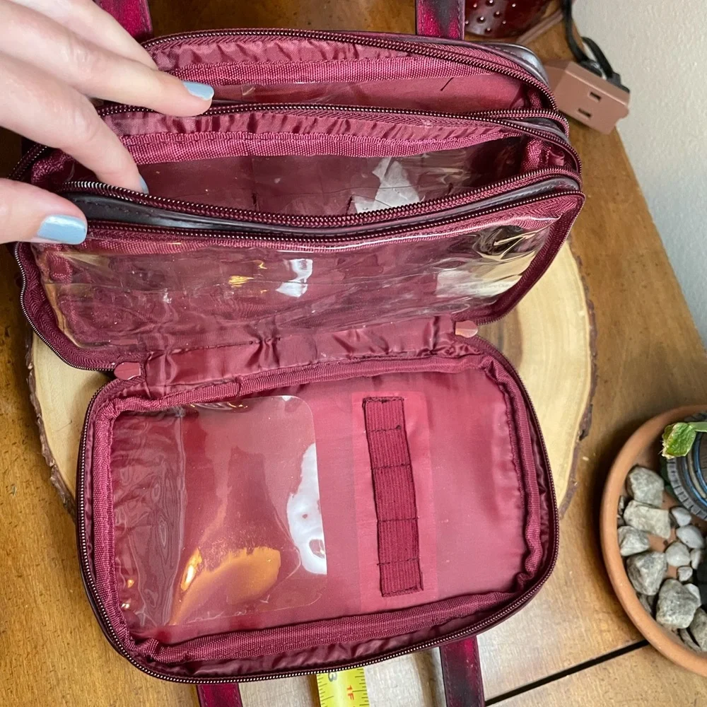 Deep burgundy iridescent handbag make up bag roomy storage opens wide zipper